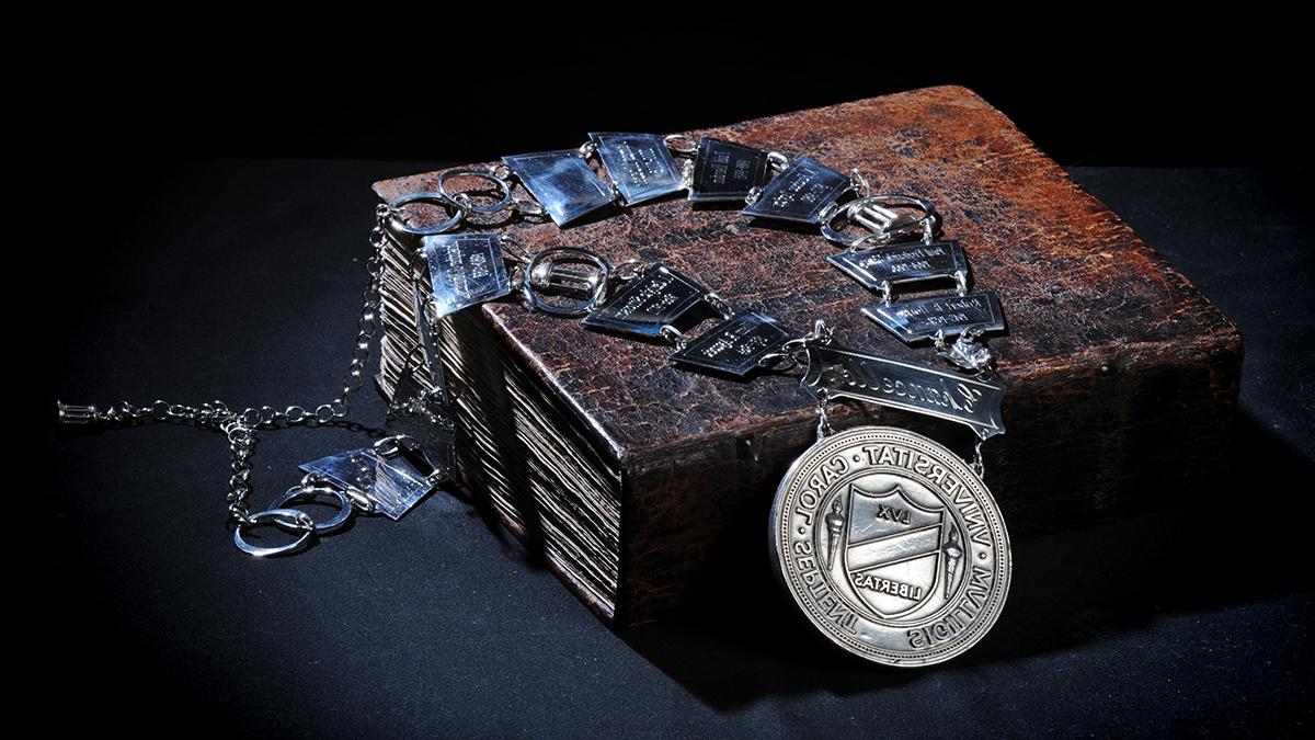 Chancellor's medallion placed over George Durant Bible with brown leather binding.